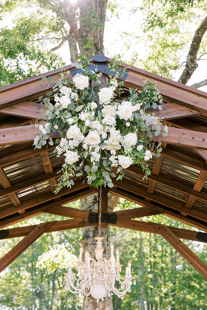flower details hanging on arbor at wedding venue